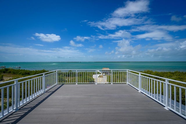 wooden deck with a water view