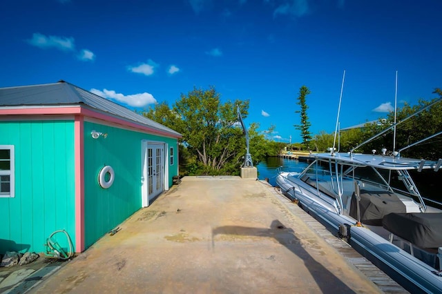 exterior space featuring french doors and a boat dock