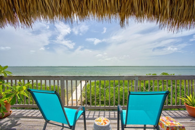 wooden terrace with a water view