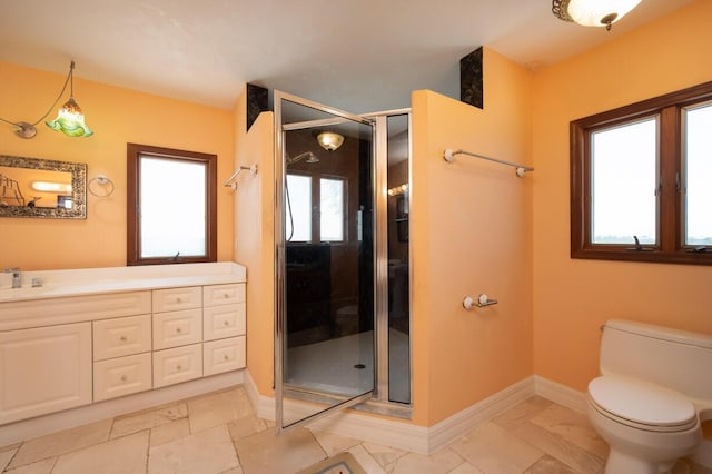 full bath featuring toilet, a stall shower, baseboards, and vanity