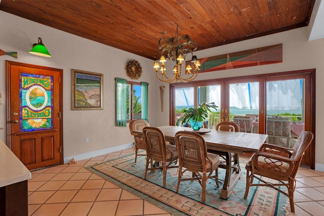 dining room featuring wood ceiling, a notable chandelier, baseboards, and light tile patterned floors