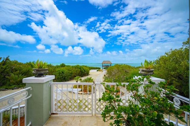 view of gate featuring a water view