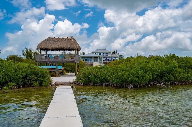 view of dock with a water view and a gazebo