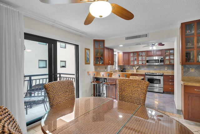 dining room with a textured ceiling