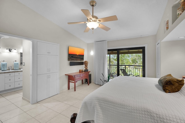 tiled bedroom featuring vaulted ceiling, ceiling fan, access to exterior, and ensuite bath