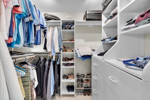 spacious closet featuring tile patterned floors