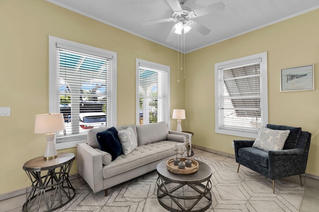 living room featuring crown molding, ceiling fan, and light tile patterned floors