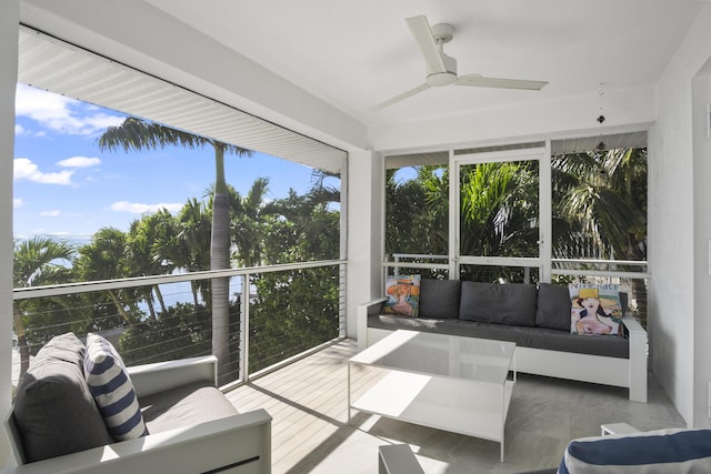 sunroom / solarium featuring a wealth of natural light and ceiling fan