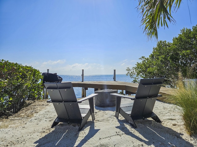 view of patio with a water view