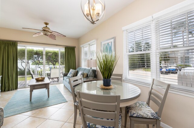 tiled dining room featuring ceiling fan