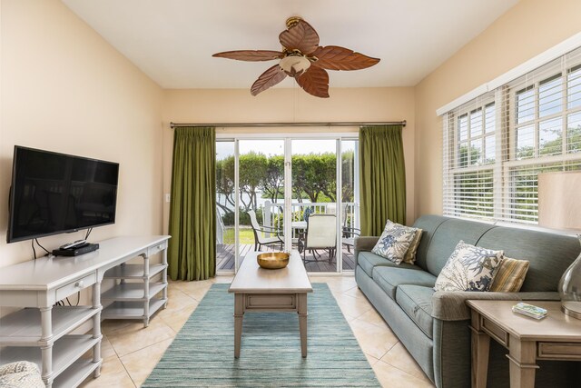 living room with ceiling fan, a healthy amount of sunlight, and light tile patterned flooring