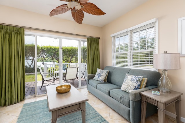 living room with light tile patterned floors and ceiling fan