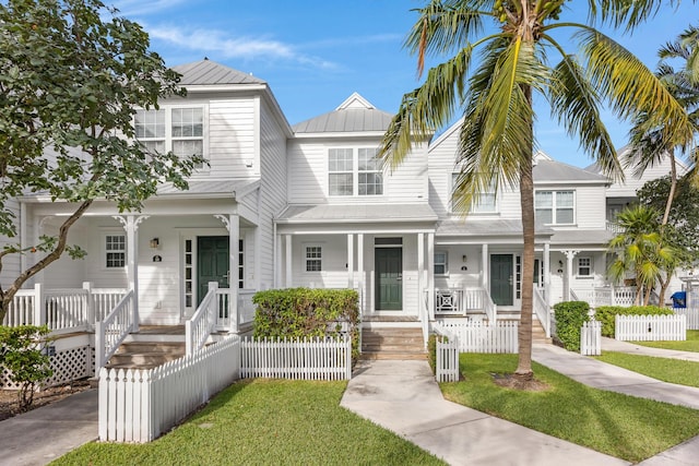 view of property featuring a front yard