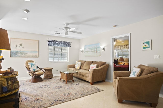 tiled living room featuring plenty of natural light and ceiling fan