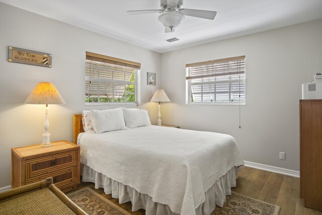 bedroom with wood-type flooring and ceiling fan