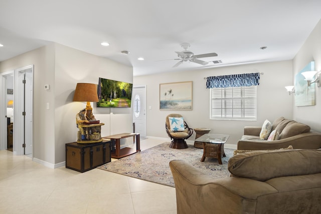 tiled living room featuring ceiling fan