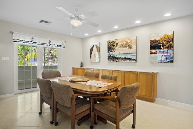 dining area featuring light tile patterned floors and ceiling fan