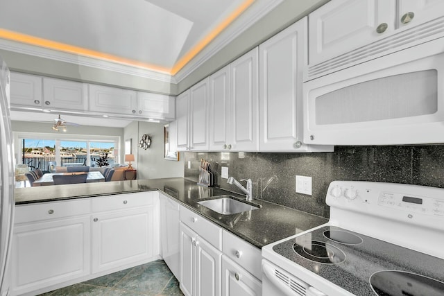 kitchen featuring sink, white cabinetry, crown molding, white appliances, and decorative backsplash