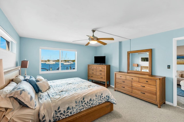 bedroom with light colored carpet and ceiling fan