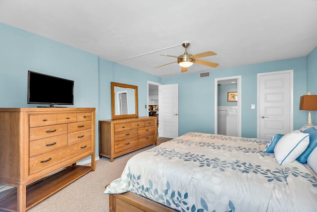 carpeted bedroom featuring ceiling fan and ensuite bathroom