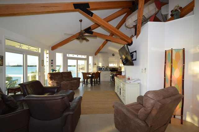 living room with light tile patterned floors, ceiling fan, high vaulted ceiling, a water view, and beamed ceiling