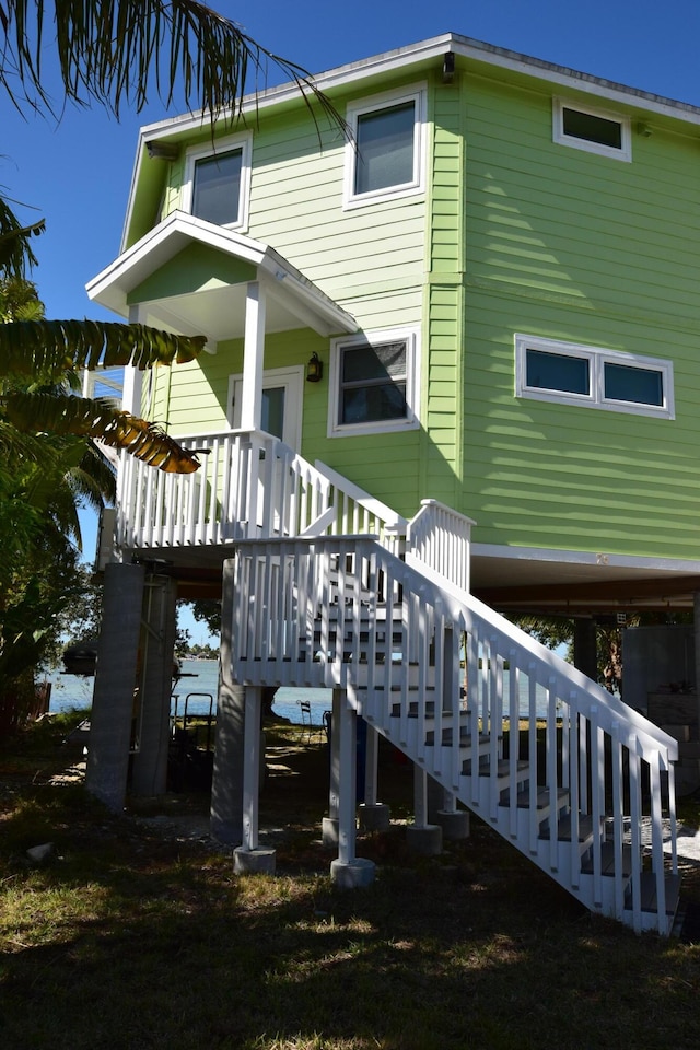 76 Palm Dr, Saddle Bunch, FL 33040 - back of house featuring stairway