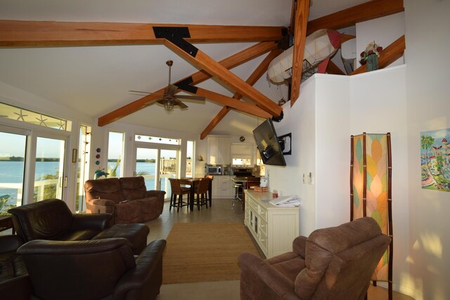 tiled living room featuring a water view, ceiling fan, high vaulted ceiling, and beamed ceiling