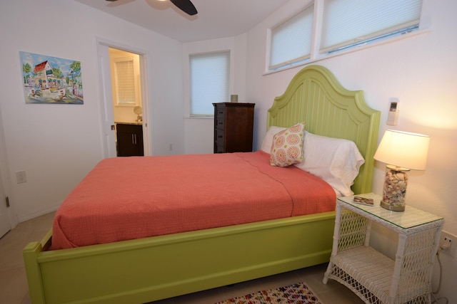 bedroom featuring ceiling fan and ensuite bathroom