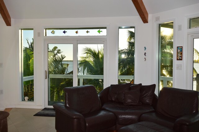 sunroom with beamed ceiling