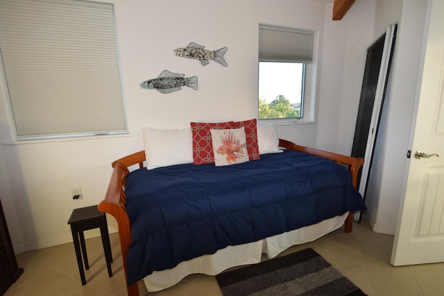 bedroom featuring light tile patterned flooring