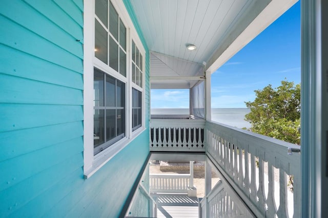 balcony featuring a water view