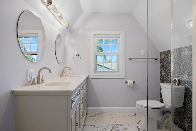 bathroom with vanity, vaulted ceiling, and toilet