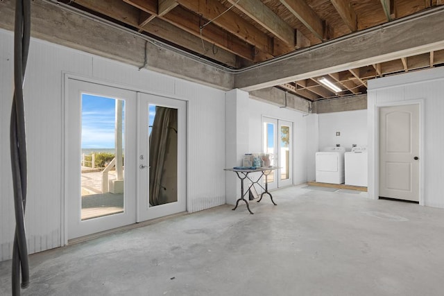 basement featuring independent washer and dryer and french doors