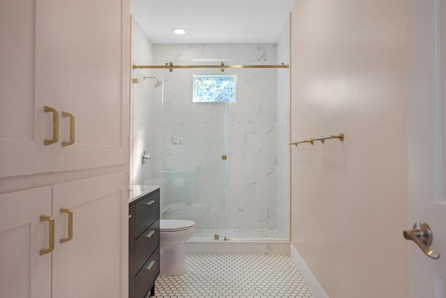 bathroom with vanity, toilet, and walk in shower