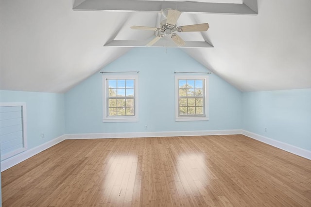 additional living space featuring ceiling fan, lofted ceiling, and light wood-type flooring