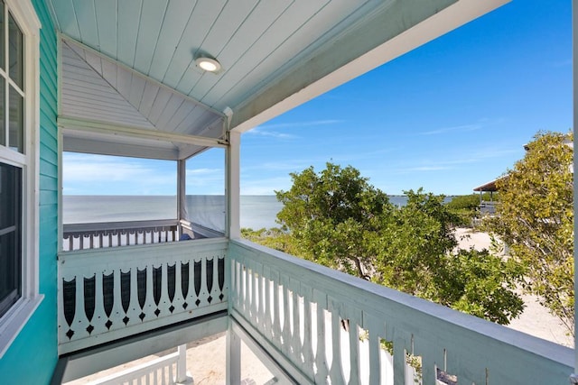 balcony featuring a water view