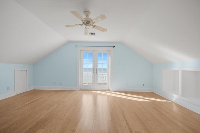 bonus room featuring vaulted ceiling, light hardwood / wood-style floors, and ceiling fan