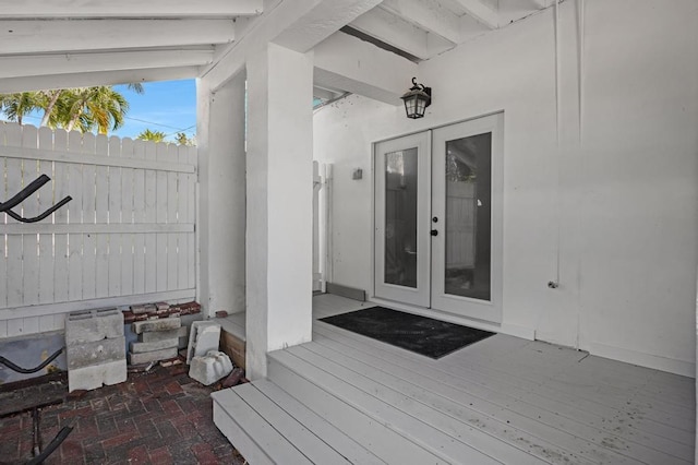 entrance to property with french doors and a wooden deck