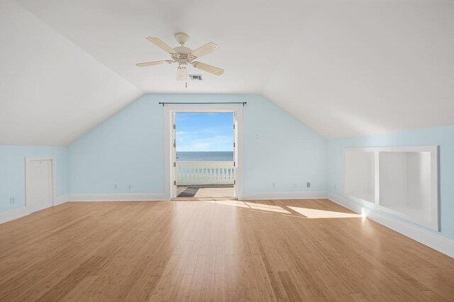 bonus room with ceiling fan, vaulted ceiling, and light hardwood / wood-style flooring