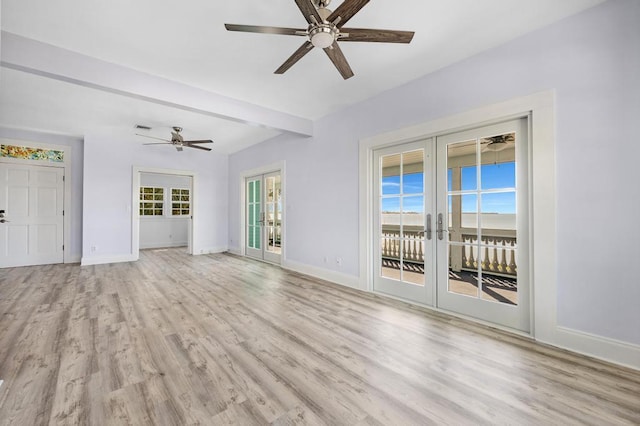 unfurnished living room featuring beamed ceiling, light hardwood / wood-style flooring, ceiling fan, and french doors