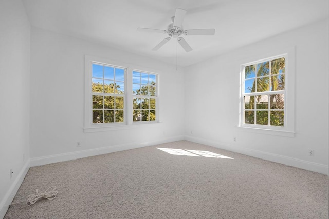 carpeted empty room with ceiling fan