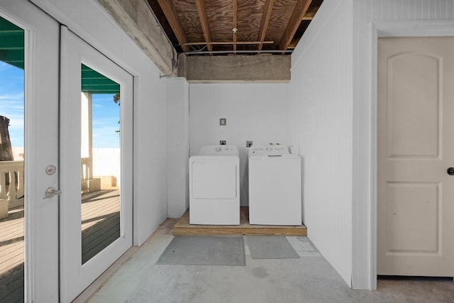 laundry room featuring french doors and separate washer and dryer