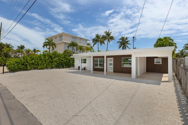 159 Iroquois Dr, Islamorada, FL 33036 - rear view of property with driveway and fence