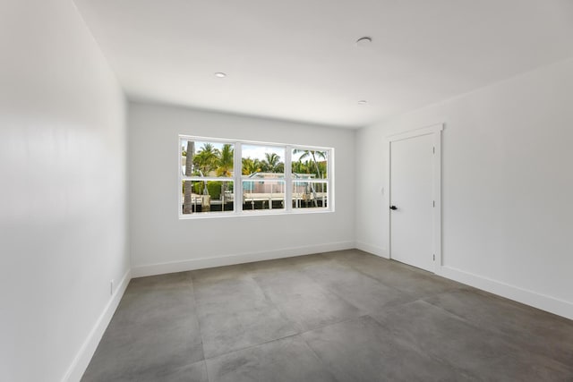 159 Iroquois Dr, Islamorada, FL 33036 - spare room featuring concrete floors and baseboards