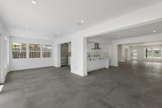 159 Iroquois Dr, Islamorada, FL 33036 - unfurnished living room with concrete floors, visible vents, baseboards, and recessed lighting