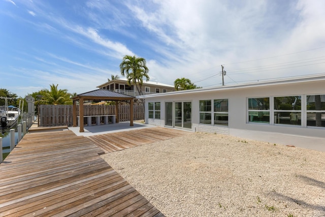 159 Iroquois Dr, Islamorada, FL 33036 - rear view of property featuring a gazebo and fence