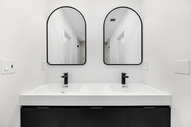 159 Iroquois Dr, Islamorada, FL 33036 - full bathroom featuring a sink, visible vents, and double vanity