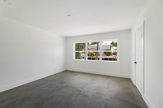 159 Iroquois Dr, Islamorada, FL 33036 - spare room featuring baseboards and finished concrete floors
