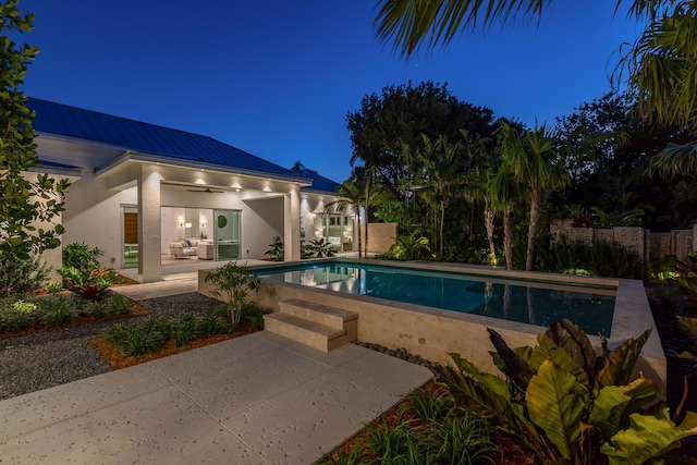 view of swimming pool with a patio area and a fenced in pool