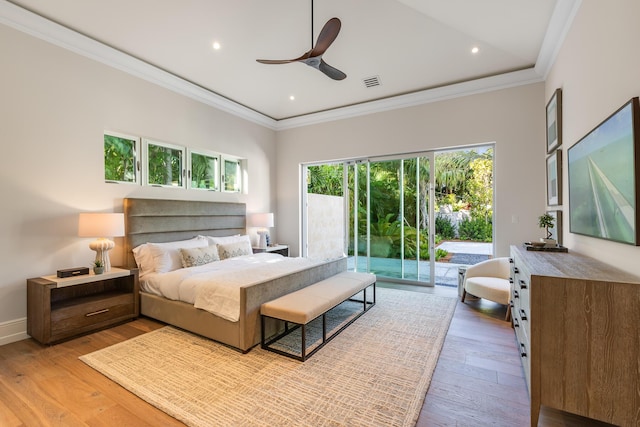 bedroom with access to exterior, visible vents, ornamental molding, light wood-type flooring, and baseboards